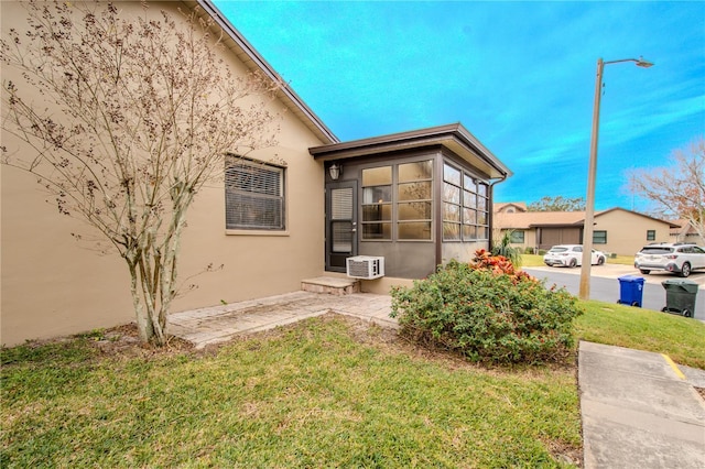 rear view of house featuring a yard