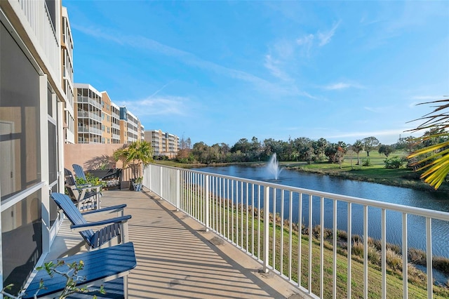 balcony featuring a water view