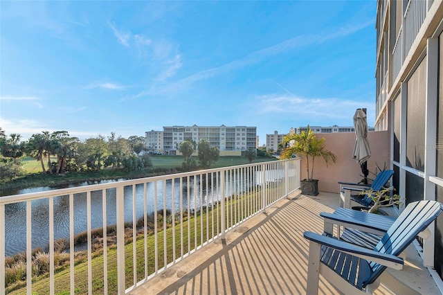 balcony featuring a water view