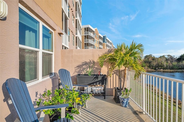 balcony featuring a water view