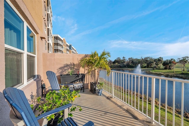 balcony featuring a water view