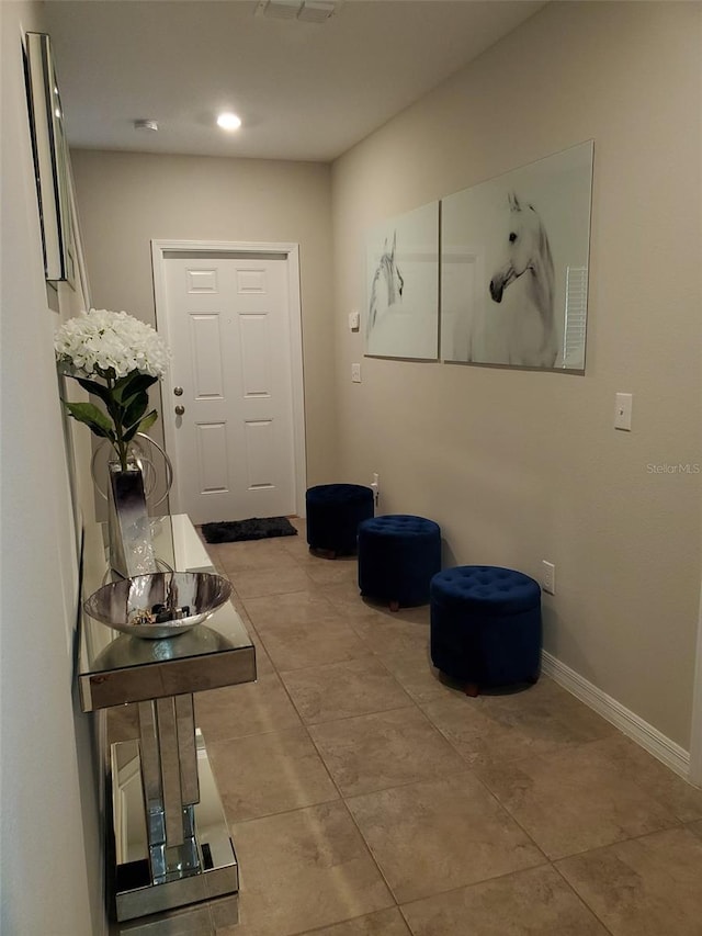 doorway to outside featuring light tile patterned floors