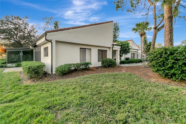 exterior space with a lawn