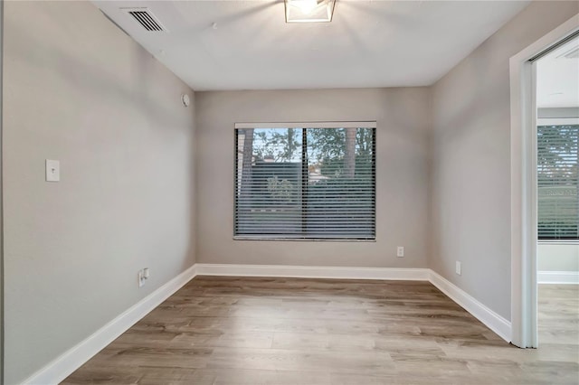 unfurnished room featuring light hardwood / wood-style floors