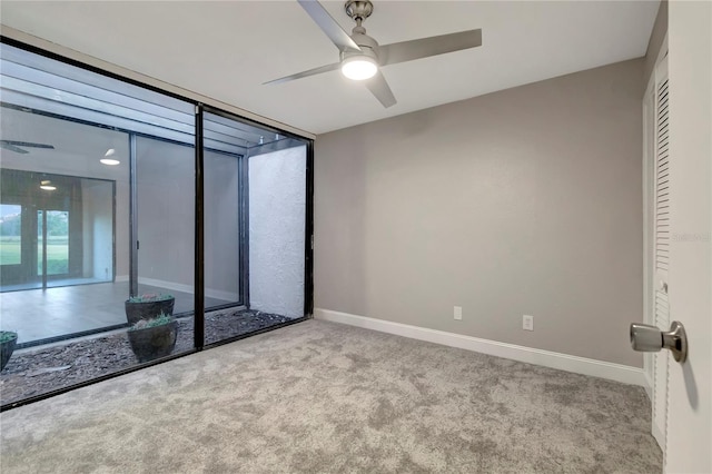 unfurnished bedroom featuring ceiling fan, a closet, and light carpet