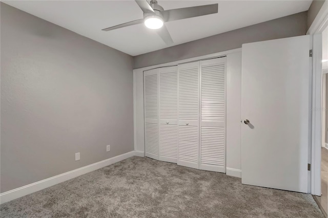 unfurnished bedroom featuring a closet, ceiling fan, and light carpet