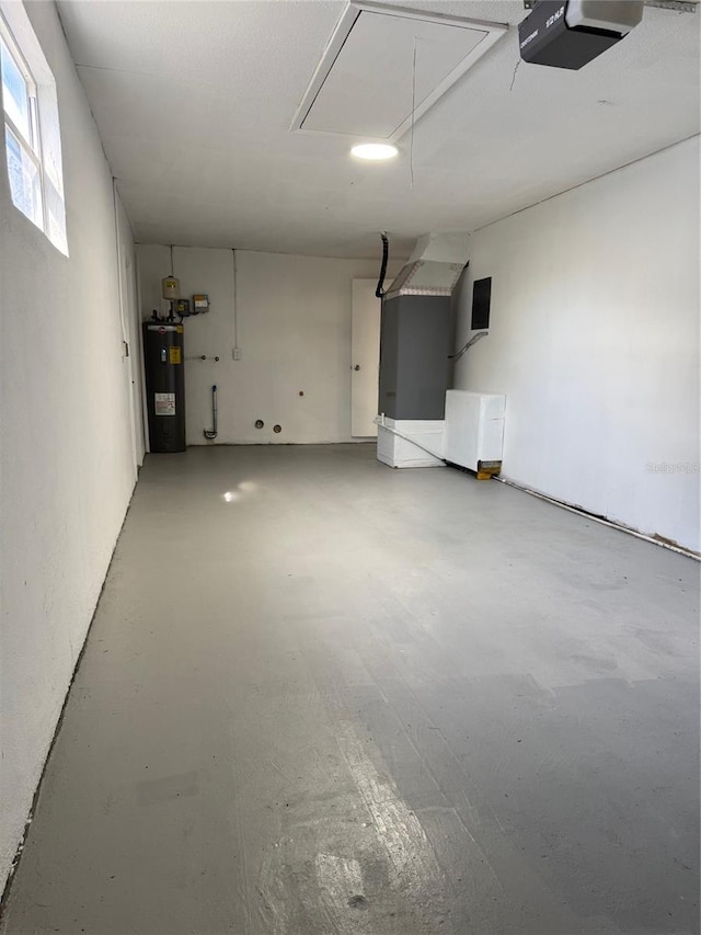 garage featuring a garage door opener and water heater