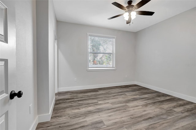 unfurnished room featuring ceiling fan and hardwood / wood-style floors