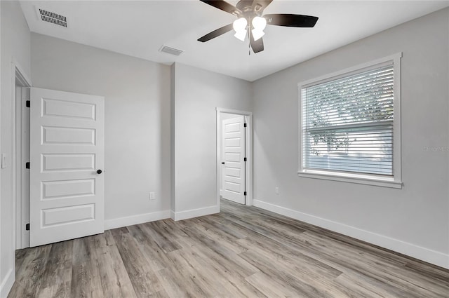 unfurnished bedroom featuring ceiling fan and light hardwood / wood-style floors