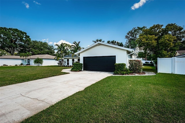 ranch-style home with a garage and a front yard