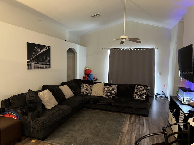 living room featuring vaulted ceiling, ceiling fan, and dark hardwood / wood-style floors