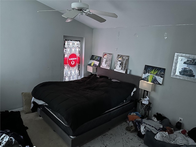 carpeted bedroom with lofted ceiling and ceiling fan