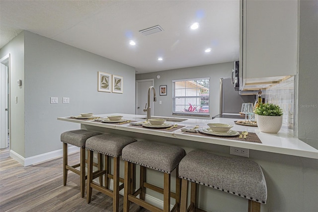 interior space featuring sink and hardwood / wood-style floors