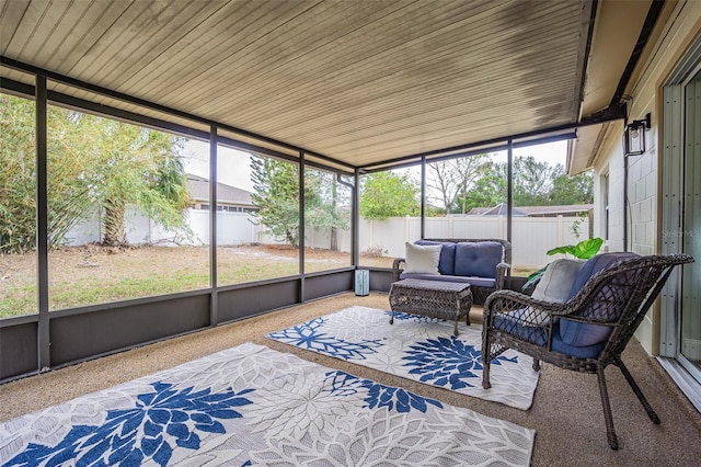 sunroom / solarium featuring wood ceiling