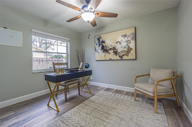 office space with ceiling fan and hardwood / wood-style flooring