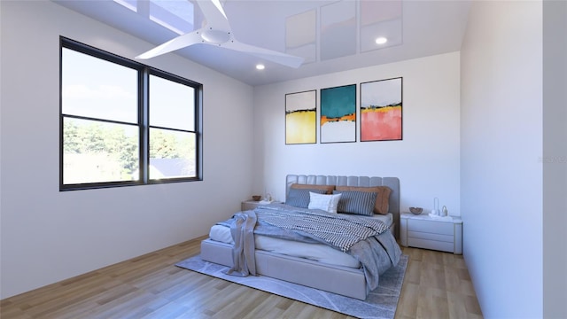 bedroom with ceiling fan and light hardwood / wood-style flooring