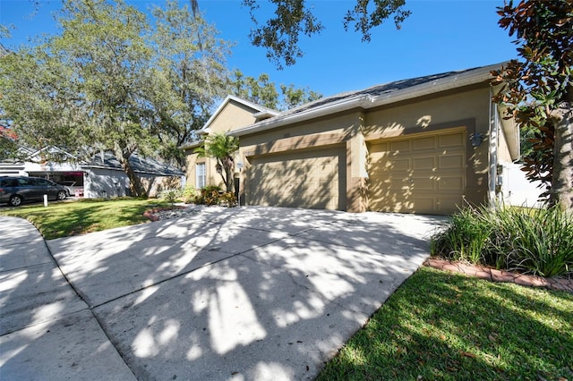 view of front facade with a front lawn and a garage