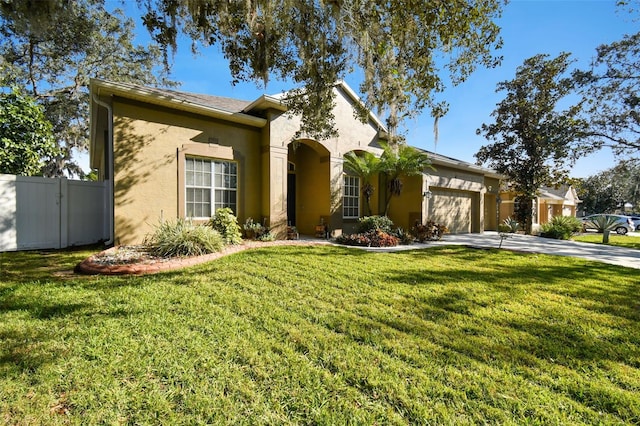 view of front of house featuring a front lawn and a garage