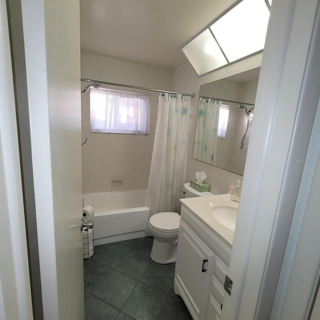 full bathroom with tile patterned flooring, toilet, vanity, and shower / tub combo with curtain