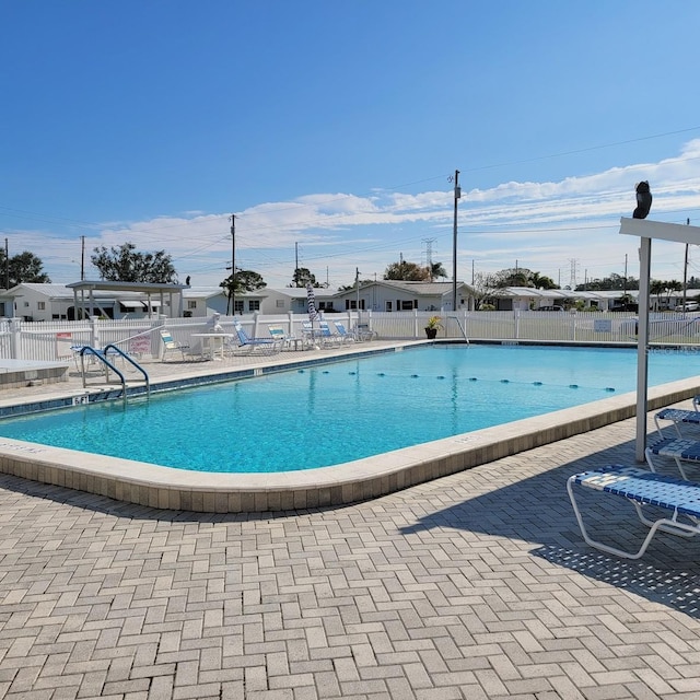 view of swimming pool with a patio