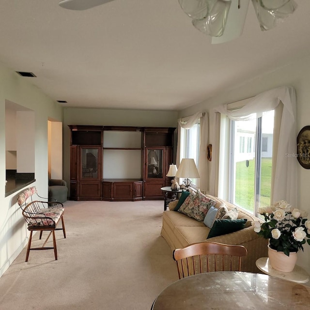 living room featuring light carpet