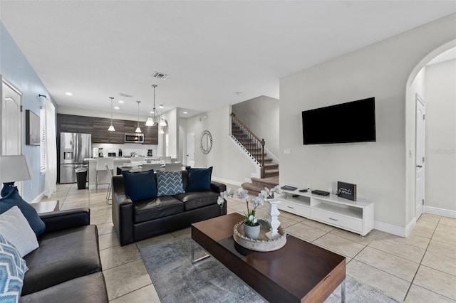 living room with light tile patterned floors