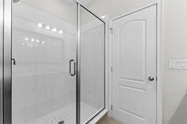 bathroom featuring a shower with door