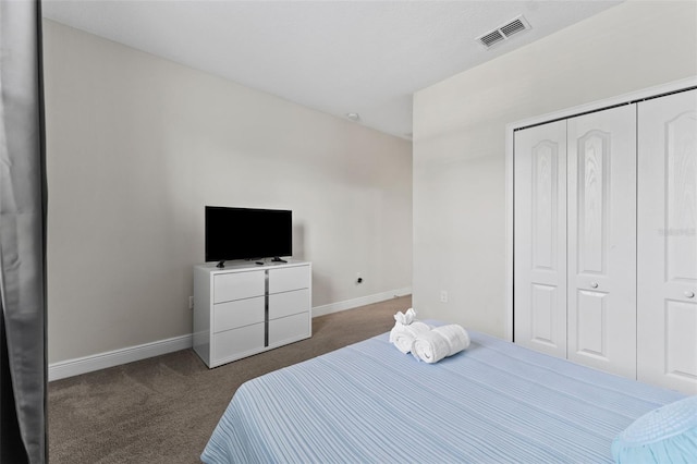 carpeted bedroom with a closet