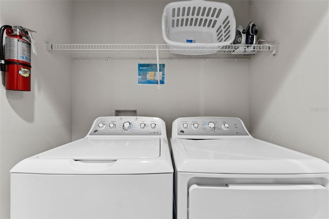 laundry room with washing machine and dryer