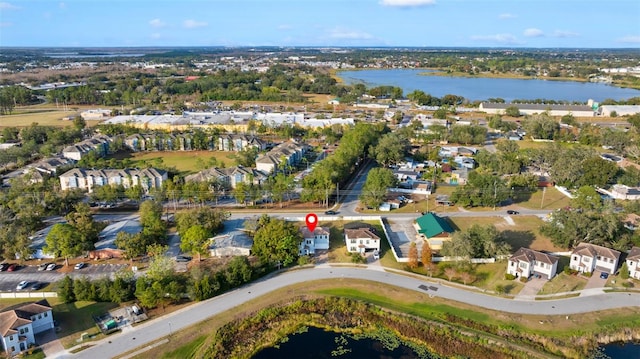 birds eye view of property with a water view