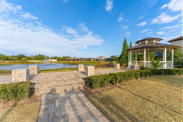 exterior space featuring a gazebo and a water view