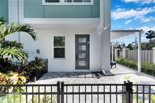 doorway to property featuring a patio area