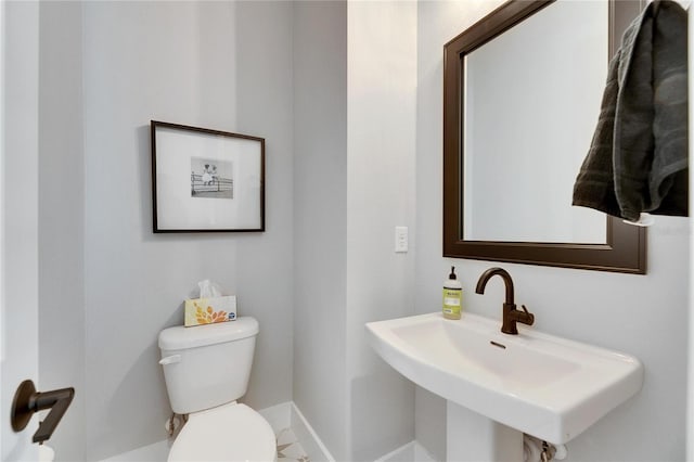 bathroom featuring sink and toilet