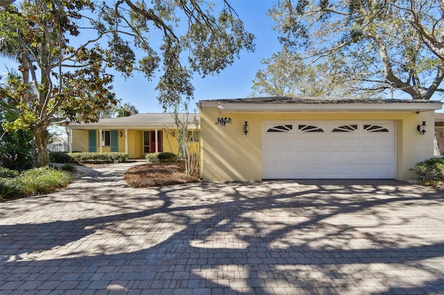 ranch-style home with a garage