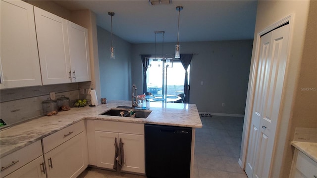 kitchen featuring sink, white cabinets, dishwasher, kitchen peninsula, and hanging light fixtures