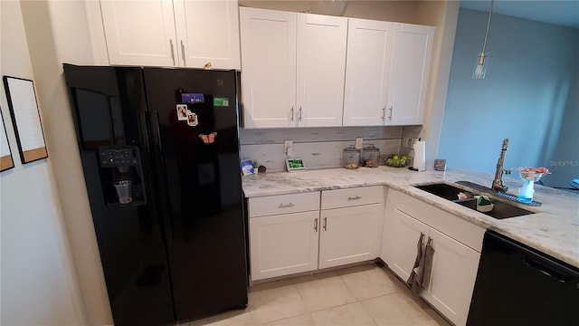 kitchen featuring sink, white cabinets, and black appliances