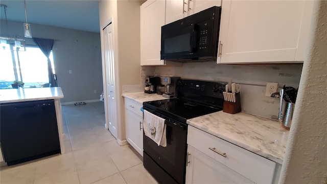 kitchen with black appliances, white cabinets, decorative light fixtures, and light tile patterned floors