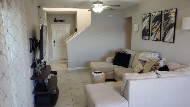 living room with ceiling fan and light tile patterned floors