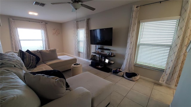 living room featuring ceiling fan and light tile patterned flooring