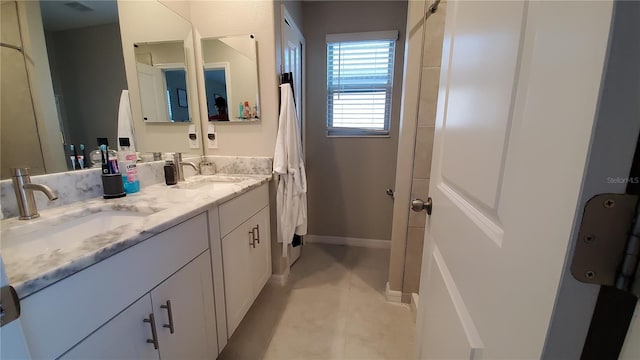 bathroom with tile patterned floors and vanity