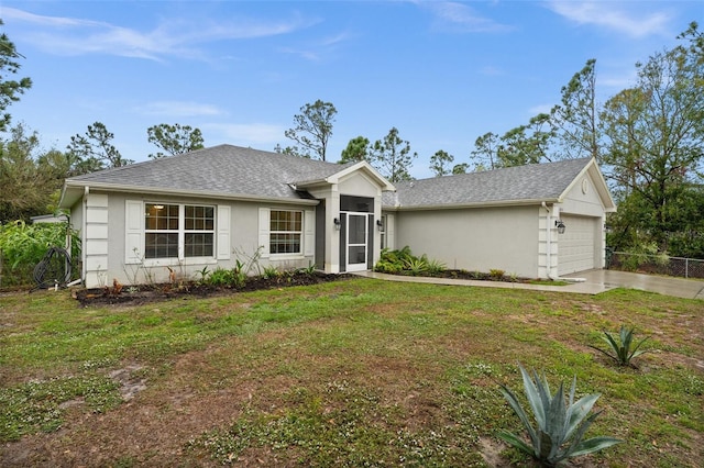 single story home featuring a garage and a front lawn