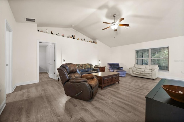 living room with lofted ceiling, hardwood / wood-style floors, and ceiling fan