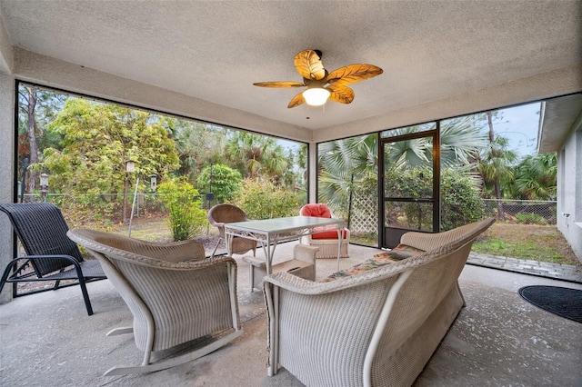 sunroom / solarium with ceiling fan