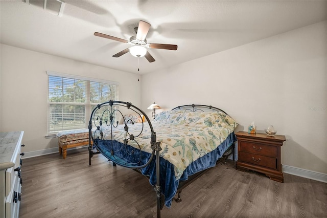 bedroom with dark wood-type flooring and ceiling fan