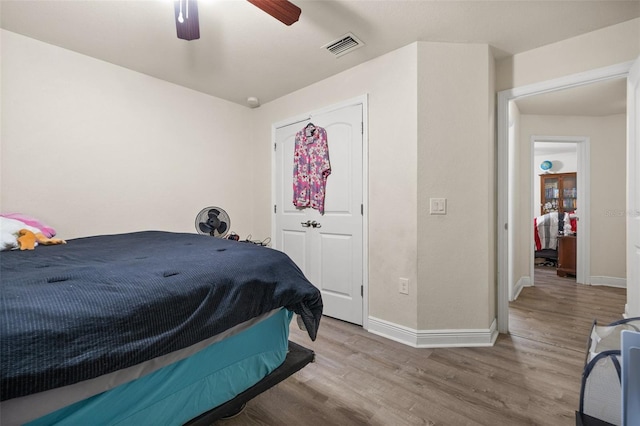 bedroom featuring ceiling fan and light hardwood / wood-style floors