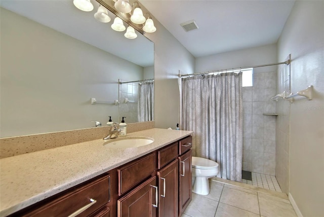 bathroom featuring toilet, a shower with shower curtain, tile patterned floors, and vanity