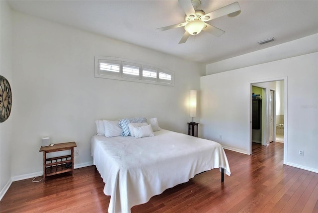 bedroom with ceiling fan and dark wood-type flooring