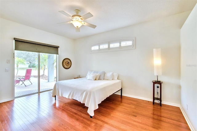 bedroom with ceiling fan, hardwood / wood-style flooring, and access to outside