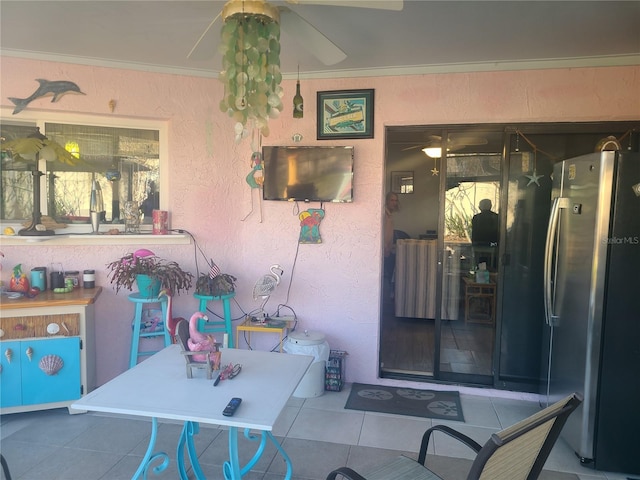 doorway to property with ceiling fan