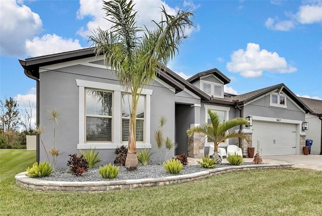 view of front of house with a front lawn and a garage